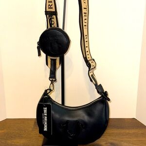NWT True Religion Black and Tan Crossbody Bag with coin purse and guitar strap.